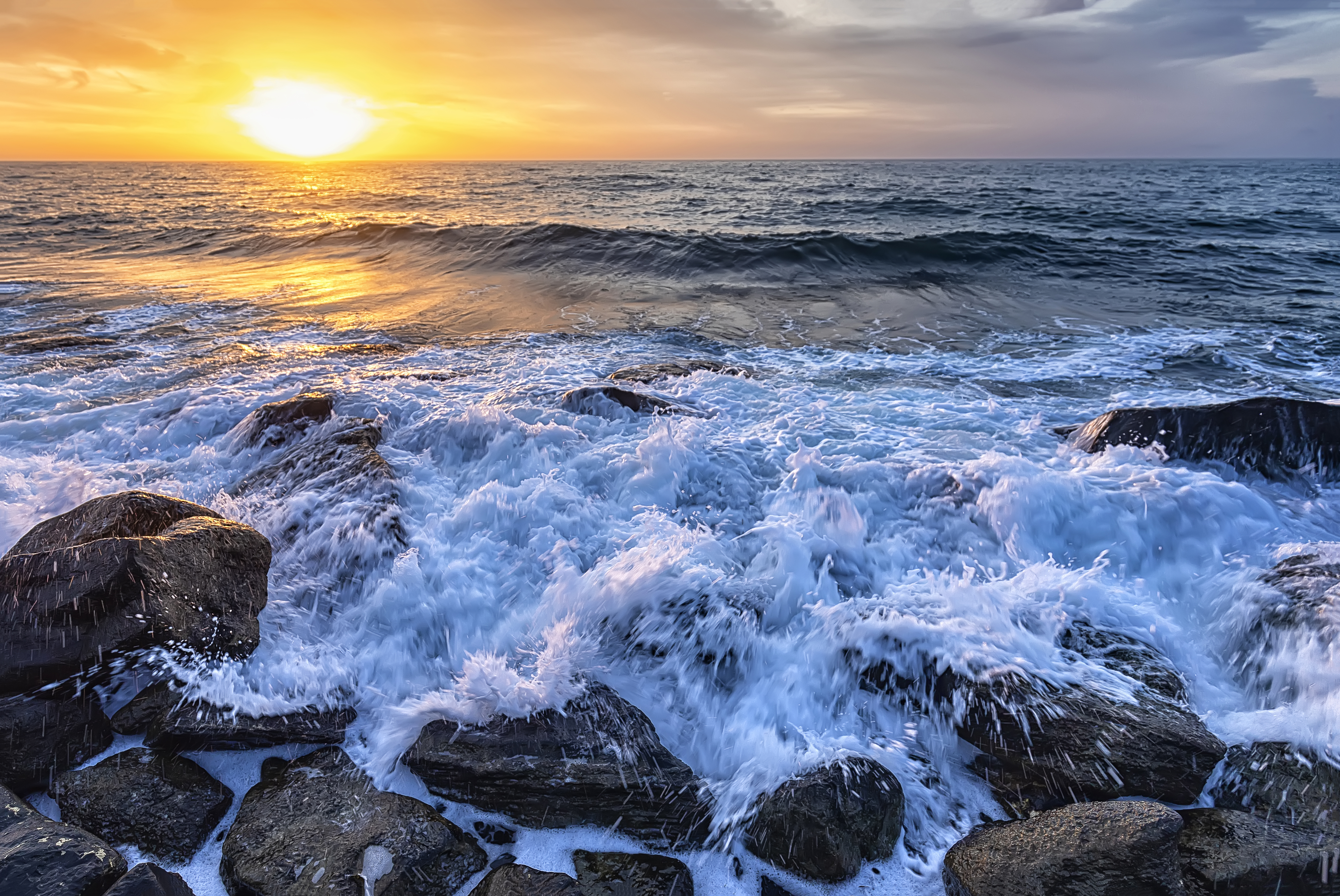 Ocean waves at sunset